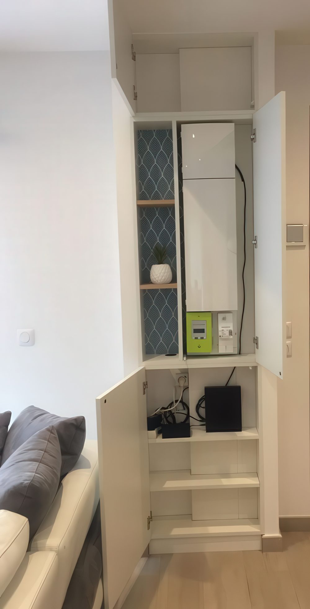 A built-in storage cabinet with shelves and storage units can hide a wi-fi router or some other stuff and declutter your space.