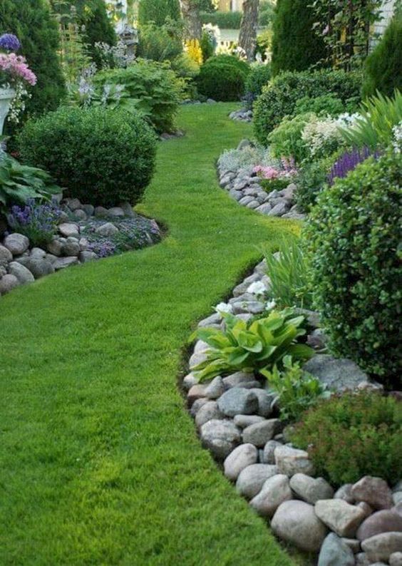 river rocks slightly frame the garden beds without being the borders, they look natural and simple.