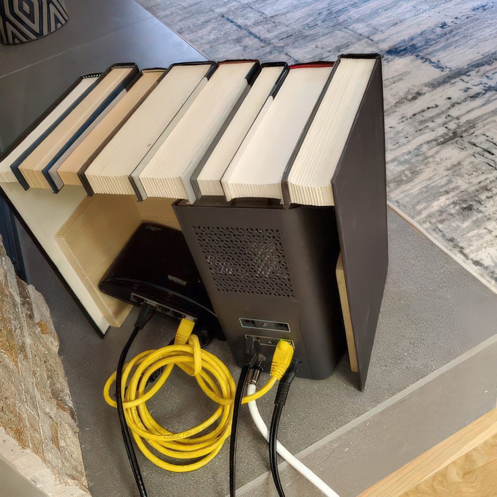 A box featuring fake books is a lovely space to hide any router or other electronics and looks very stylish.