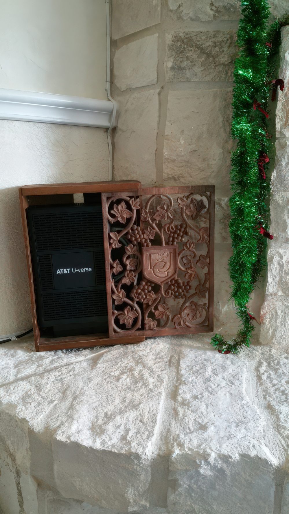 A chic carved wooden box to hide a wi-fi router is a stylish idea for many spaces and looks refined and cool.