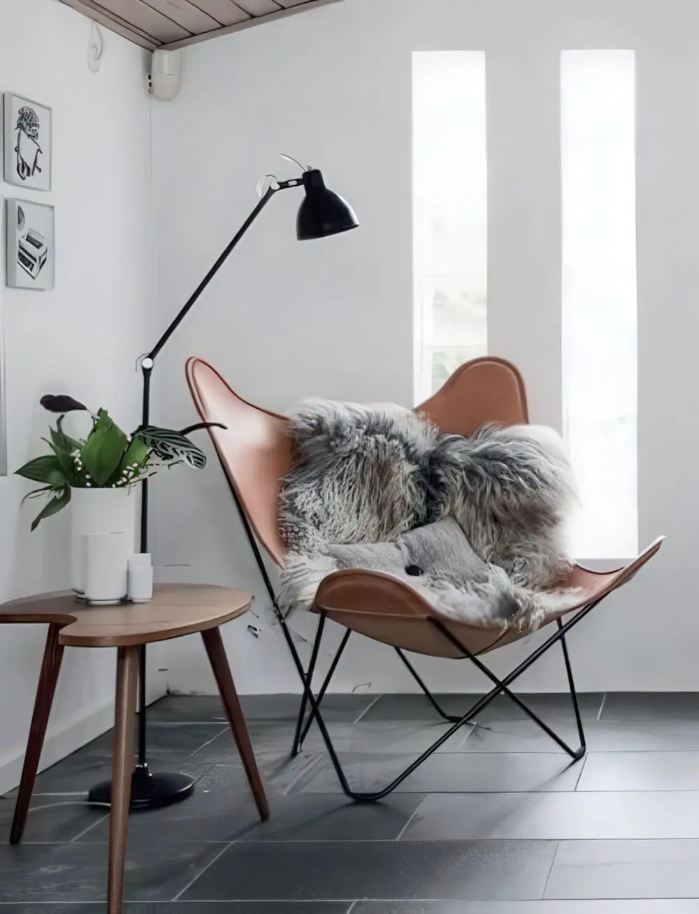 A stylish nook with a leather chair, a floor lamp and a side table is ideal for reading - just add pillows.