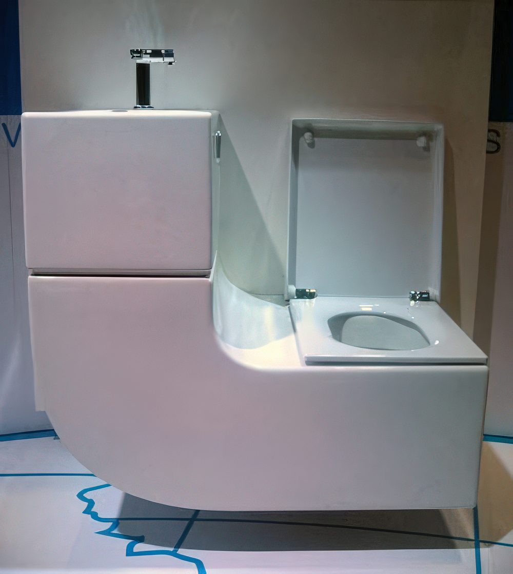 Sleek curved sink+toilet combo.