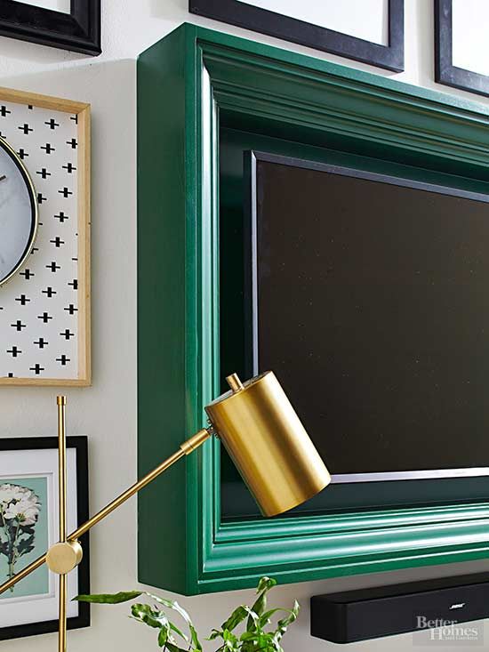 A TV placed in a picture frame that highlights it and hides all the cords inside it, so you get an elegant and sleek look.