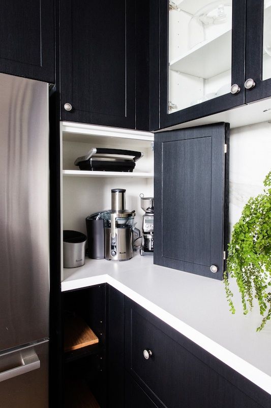 Add a folding door to the open space on your countertops to hide kitchen appliances and keep the kitchen look neat and elegant.