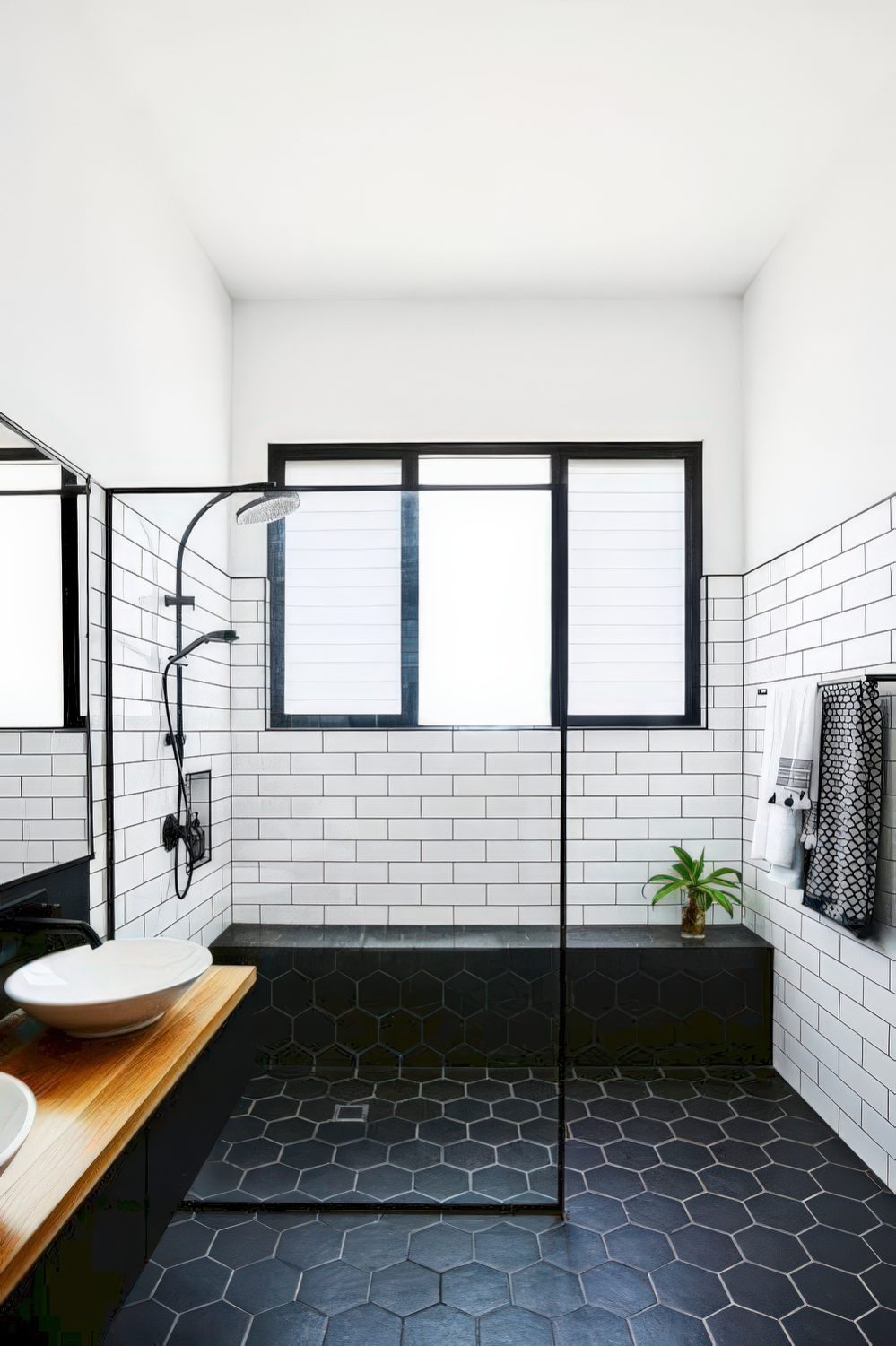 A framed window in the shower for enjoying views, natural light but still no privacy.