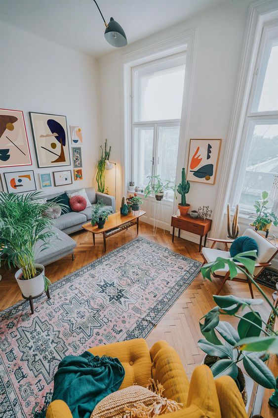 A mustard chair, bright artworks and potted plants here and there will make your living room feel like summer.