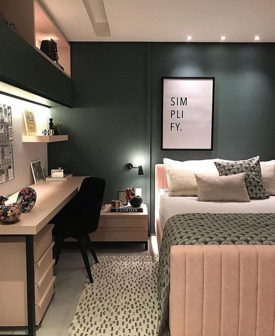Create a stylish teen girl bedroom in hunter green and blush, with built-in storage for extra space. Lights and printed textiles add personality and charm. This design offers a practical and vibrant environment.