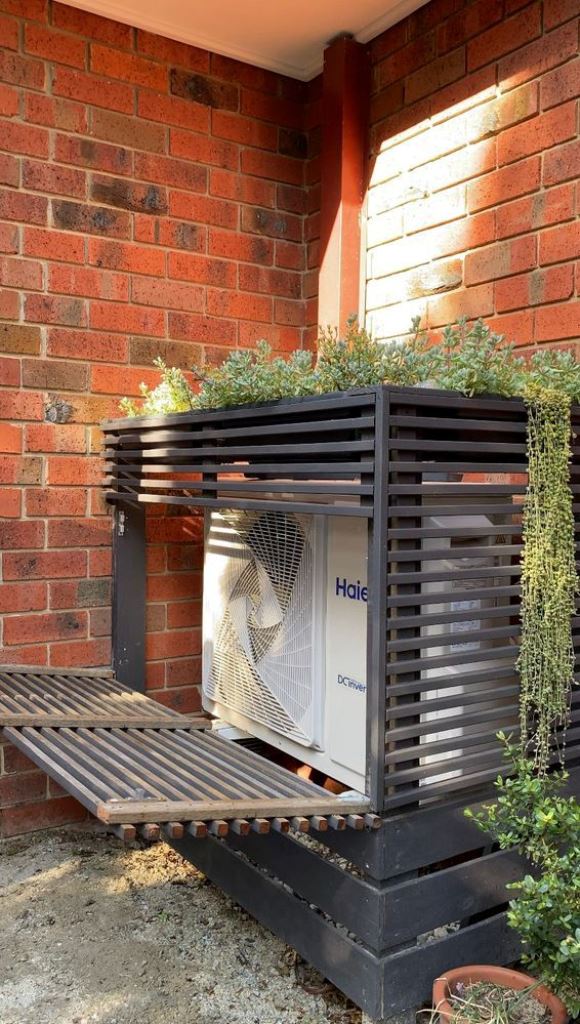 The black box of wide and thin slats is a cool and trendy solution, and greenery on top adds style. 

(via workshop).