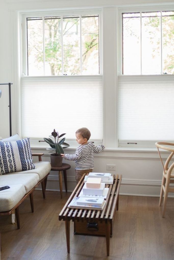 The windows are partly covered with blinds, so that are views were seen but daylight still comes in.