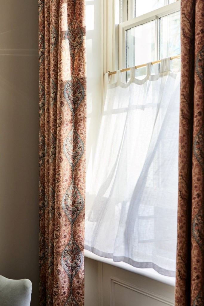 Cafe and usual curtains paired will block any non-attractive view while letting light in.