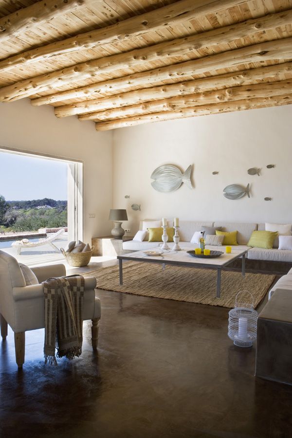 Bold pillows and a gorgeous outdoor opening for bringing a summer feel to the living room.