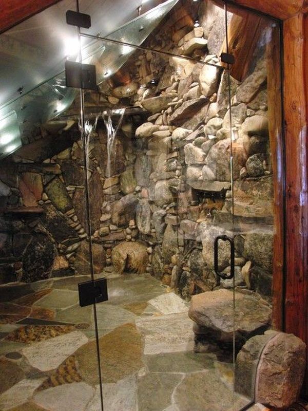 A nature-inspired shower clad with natural sone, with lights and waterfall-like showers is a great and very unusual idea to become closer to nature.