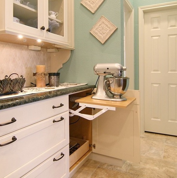 A cabinet with a retractable shelf and a mixer plus some cutlery under it is a cool idea for any kitchen.