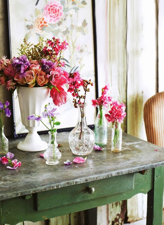 Elegant and refined vintage crystal and porcelain vases with super bright blooms for summer home decor.