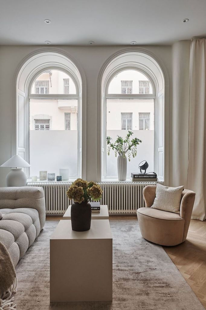 The gorgeous arched windows are treated with non-sheer film, which adds privacy, and no other treatments are necessary here.