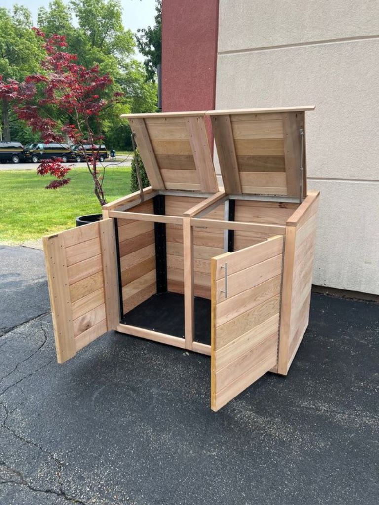 This light-stained double box with a lid is great to hide a couple of trash cans.