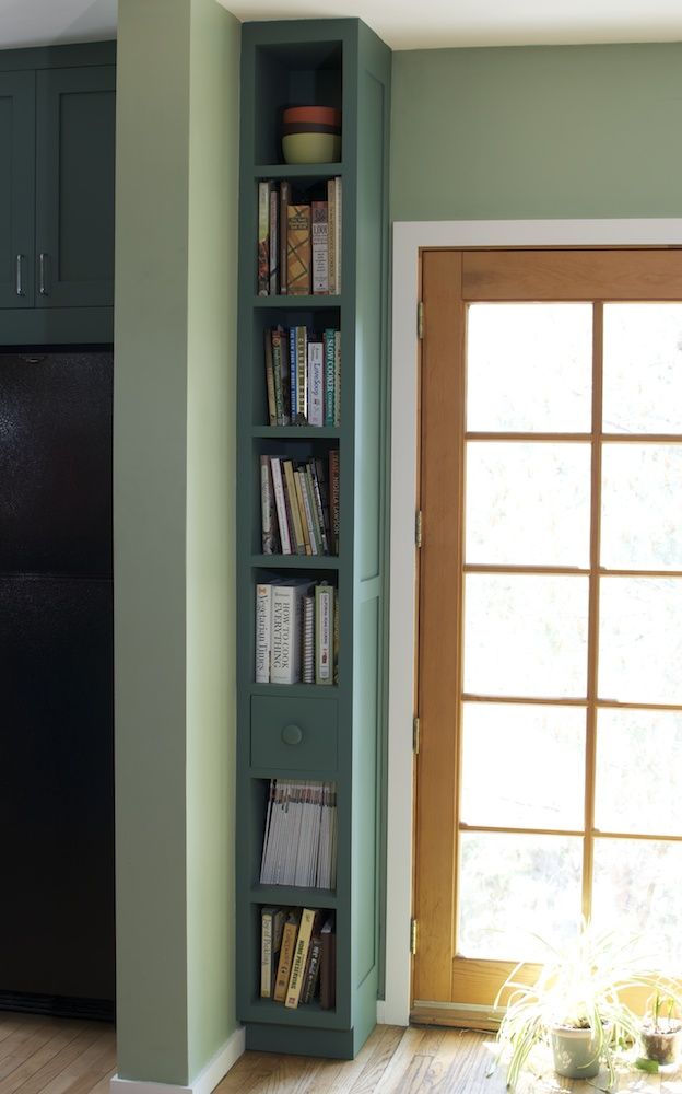 This tall and narrow shelf is a whole mini bookcase, though it takes minimum of space.

(via todosomething).