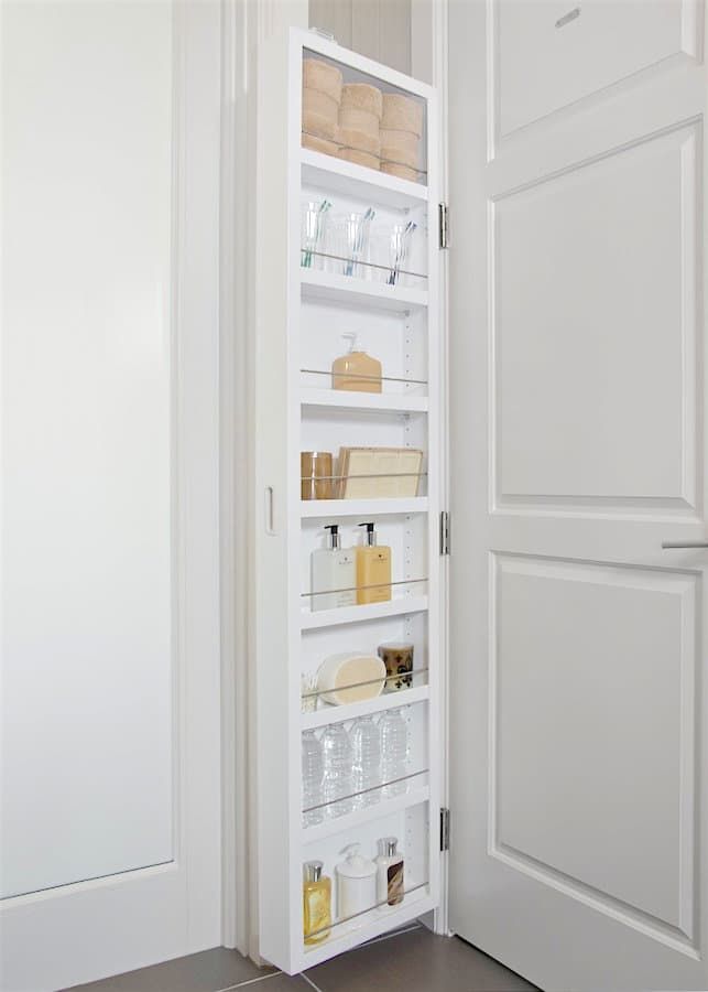 This tall and very slim rack merges with the walls and looks lightweight, great for a white bathroom.